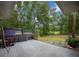 Concrete patio with generator and a fenced-in yard creating a relaxed and private space at 21168 Sw Peach Blossom St, Dunnellon, FL 34431