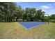An outdoor basketball court provides an excellent recreational space for sports and fitness activities at 21168 Sw Peach Blossom St, Dunnellon, FL 34431
