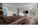 Cozy bedroom with a view of an adjacent bathroom at 21168 Sw Peach Blossom St, Dunnellon, FL 34431