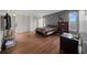Spacious bedroom featuring wood floors, natural light, and closet space at 21168 Sw Peach Blossom St, Dunnellon, FL 34431