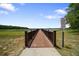 Dock with signs and railing, offering a safe and enjoyable waterfront experience for residents at 21168 Sw Peach Blossom St, Dunnellon, FL 34431