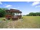 Picturesque gazebo overlooking the water, offering a tranquil space for relaxation and scenic views at 21168 Sw Peach Blossom St, Dunnellon, FL 34431