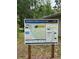 Informative sign at Rainbow Springs State Park, detailing park entrances, points of interest, and trail details at 21168 Sw Peach Blossom St, Dunnellon, FL 34431