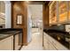 Butler's pantry that offers ample counter space, custom cabinetry, and a wine cooler at 2146 Se 25Th Loop, Ocala, FL 34471