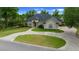 Beautiful single-story home with a well-manicured lawn and circular driveway at 2146 Se 25Th Loop, Ocala, FL 34471