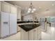 Beautiful kitchen with granite countertops, an island, and stainless steel appliances at 2146 Se 25Th Loop, Ocala, FL 34471