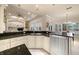 Bright kitchen with dark countertops, stainless steel appliances, ample cabinet space, and a view of the backyard at 2146 Se 25Th Loop, Ocala, FL 34471