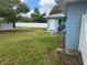 This backyard has a white privacy fence, shed and blue siding on the exterior of the home at 21570 Sw Raintree St, Dunnellon, FL 34431