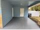 Spacious carport featuring a concrete floor and ample space for parking and storage at 21570 Sw Raintree St, Dunnellon, FL 34431