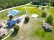 Expansive community park featuring playground, basketball court, and green spaces at 21570 Sw Raintree St, Dunnellon, FL 34431