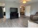 Open living room featuring tile floors and a view into the dining area at 21570 Sw Raintree St, Dunnellon, FL 34431