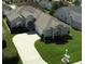 Aerial view of a single-Gathering home, showcasing its well-maintained roof, manicured lawn, and neighborhood setting at 2323 Nw 55Th Avenue Rd, Ocala, FL 34482