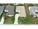 An aerial view highlighting the home in its neighborhood context, with lawn, driveway, and roof at 2323 Nw 55Th Avenue Rd, Ocala, FL 34482