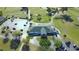 Aerial view of clubhouse featuring an abundance of parking, lush landscaping, and easy access to all amenities at 2323 Nw 55Th Avenue Rd, Ocala, FL 34482