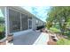 This home features a beautiful screened lanai with lush landscaping in the back yard at 2323 Nw 55Th Avenue Rd, Ocala, FL 34482