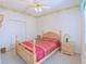 Bedroom with natural wood furniture, patterned carpet, and neutral wallpaper at 2323 Nw 55Th Avenue Rd, Ocala, FL 34482