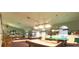 Enjoy a game of pool in the billiards room, with multiple tables and stylish lighting fixtures at 2323 Nw 55Th Avenue Rd, Ocala, FL 34482