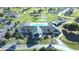 The community clubhouse features a pool, lounge chairs, and mature palm trees at 2323 Nw 55Th Avenue Rd, Ocala, FL 34482