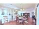 Bright dining room featuring hardwood floors, a chandelier, and open layout at 2323 Nw 55Th Avenue Rd, Ocala, FL 34482
