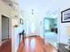 Welcoming foyer featuring hardwood floors, a glass front door, and views into the office at 2323 Nw 55Th Avenue Rd, Ocala, FL 34482