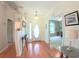 Welcoming foyer featuring hardwood floors, a front door with glass, and views into other living spaces at 2323 Nw 55Th Avenue Rd, Ocala, FL 34482