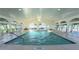 Bright, airy indoor pool area features high ceilings, large windows, and a comfortable swimming environment at 2323 Nw 55Th Avenue Rd, Ocala, FL 34482