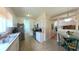 Functional kitchen with white cabinets, stainless steel appliances, and convenient access to the dining area at 2323 Nw 55Th Avenue Rd, Ocala, FL 34482