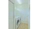 Bright laundry room includes tile flooring, LG washer and dryer, and ample storage shelving at 2323 Nw 55Th Avenue Rd, Ocala, FL 34482