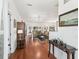 Inviting living room featuring hardwood floors, neutral walls, with an entryway and decorative accent tables at 2323 Nw 55Th Avenue Rd, Ocala, FL 34482