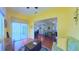 Comfortable seating in yellow living room, open layout with access to patio and dining area at 2323 Nw 55Th Avenue Rd, Ocala, FL 34482
