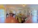 Expansive living room featuring hardwood floors, comfortable furniture, and an open-concept design at 2323 Nw 55Th Avenue Rd, Ocala, FL 34482