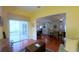Open-concept living space connecting the living room, dining area, and porch with ample natural light at 2323 Nw 55Th Avenue Rd, Ocala, FL 34482