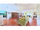 Open living room with hardwood floors, large entertainment center, and view to other rooms at 2323 Nw 55Th Avenue Rd, Ocala, FL 34482