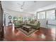 Bright living room features hardwood floors and seamless transition to kitchen and dining areas at 2323 Nw 55Th Avenue Rd, Ocala, FL 34482