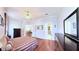 Well-lit main bedroom with hardwood floors, ceiling fan and furniture at 2323 Nw 55Th Avenue Rd, Ocala, FL 34482