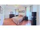 Spacious main bedroom with wood flooring and natural light from multiple windows at 2323 Nw 55Th Avenue Rd, Ocala, FL 34482