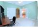 Home office with a built-in bookcase, French doors and neutral carpet at 2323 Nw 55Th Avenue Rd, Ocala, FL 34482
