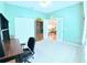 Bright office space featuring neutral carpet, a ceiling fan, a large closet, and an adjacent seating area at 2323 Nw 55Th Avenue Rd, Ocala, FL 34482