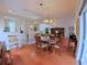 Open-concept living and dining area with hardwood floors, natural light, and easy access to the kitchen at 2323 Nw 55Th Avenue Rd, Ocala, FL 34482