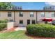 Outdoor patio features lush landscaping, a privacy wall, lawn space and offers space for relaxing and grilling at 2433 Ne 7Th St # 3, Ocala, FL 34470