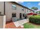 Outdoor patio features lush landscaping, a privacy wall, lawn space and offers space for relaxing and grilling at 2433 Ne 7Th St # 3, Ocala, FL 34470