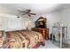 Another cozy bedroom offers traditional furniture, mirrored dresser, carpet flooring, ceiling fan, and closet storage at 2433 Ne 7Th St # 3, Ocala, FL 34470