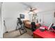 Bright bedroom with a ceiling fan, closet, red accent table and inversion table provides a functional and comfortable space at 2433 Ne 7Th St # 3, Ocala, FL 34470