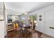 Dining area featuring a decorative mirror, hardwood floors, a table setting, and natural light at 2433 Ne 7Th St # 3, Ocala, FL 34470