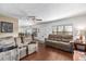 Open-concept living area with hardwood floors, plush seating, and views into the dining area and entryway at 2433 Ne 7Th St # 3, Ocala, FL 34470