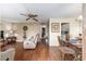 Cozy living room with rich flooring, comfortable seating, and a dining area with decorative table setting at 2433 Ne 7Th St # 3, Ocala, FL 34470