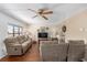 Inviting living room featuring hardwood floors, recessed lighting, comfortable seating, and a large window at 2433 Ne 7Th St # 3, Ocala, FL 34470