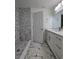 Modern bathroom with a new shower, vanity with sink, and elegant marble-look tile floors at 263 Oak Lane Trak, Ocala, FL 34472