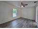 A bright, airy bedroom with hard surface floors, ceiling fan, and natural light at 263 Oak Lane Trak, Ocala, FL 34472