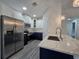 Kitchen featuring stainless steel appliances, quartz countertops, and white and navy blue cabinets at 263 Oak Lane Trak, Ocala, FL 34472